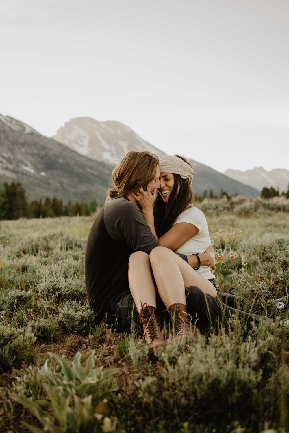 Couple snuggling for their engagements in the Grand Teton National Park.jpg