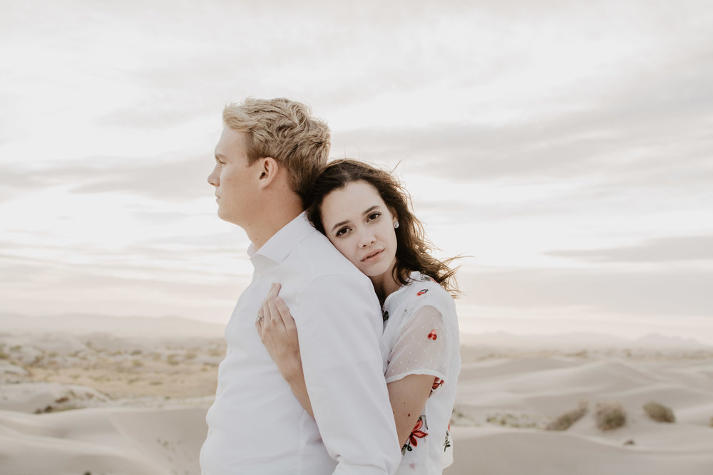 Dreamy engagements in the Little Sahara Desert with white dress and wind in the hair-18.jpg