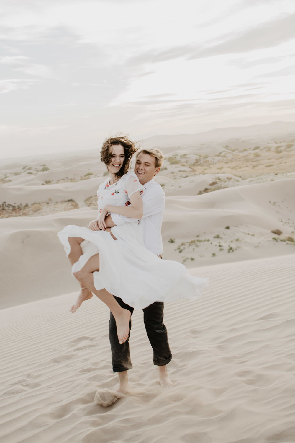 Jocilyn Bennett Photography | Engagement Pose Ideas | Destination Wedding Photographer | Elopement Wedding Photographer | National Park Elopement Photography | Capturing raw and genuine emotion | Utah Photographer | Utah wedding Photographer | National Park Weddings | Outfit ideas for engagements | Engagements with sand | Adventure Photographer | What to wear guide for engagement | Little sahara engagements | Location ideas for engagements |