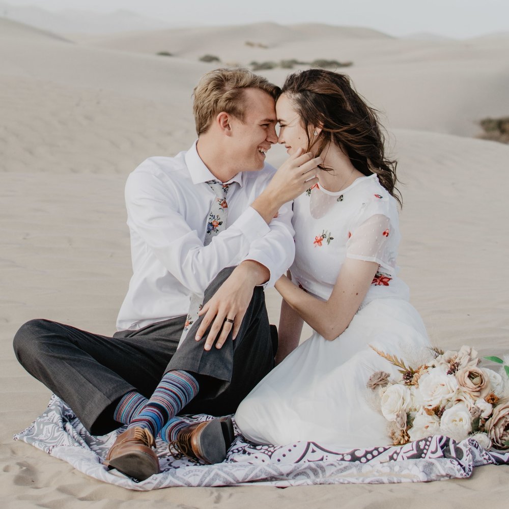 Dreamy engagements in the Little Sahara Desert with white dress and wind in the hair-4.jpg