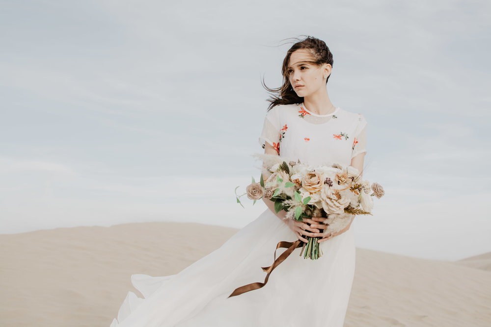 Dreamy engagements in the Little Sahara Desert with white dress and wind in the hair-7.jpg