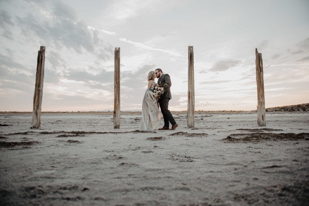 Jocilyn Bennett Photography | Destination Wedding Photographer | Elopement Wedding Photographer | National Park Elopement Photography | Capturing raw and genuine emotion | Utah Photographer | Utah wedding Photographer | National Park Weddings | Adventure Photographer | Bohemian photography | Bohemian wedding | Spiral Jetty photography | Bridals at the Spiral Jetty | Hand painted wedding gown