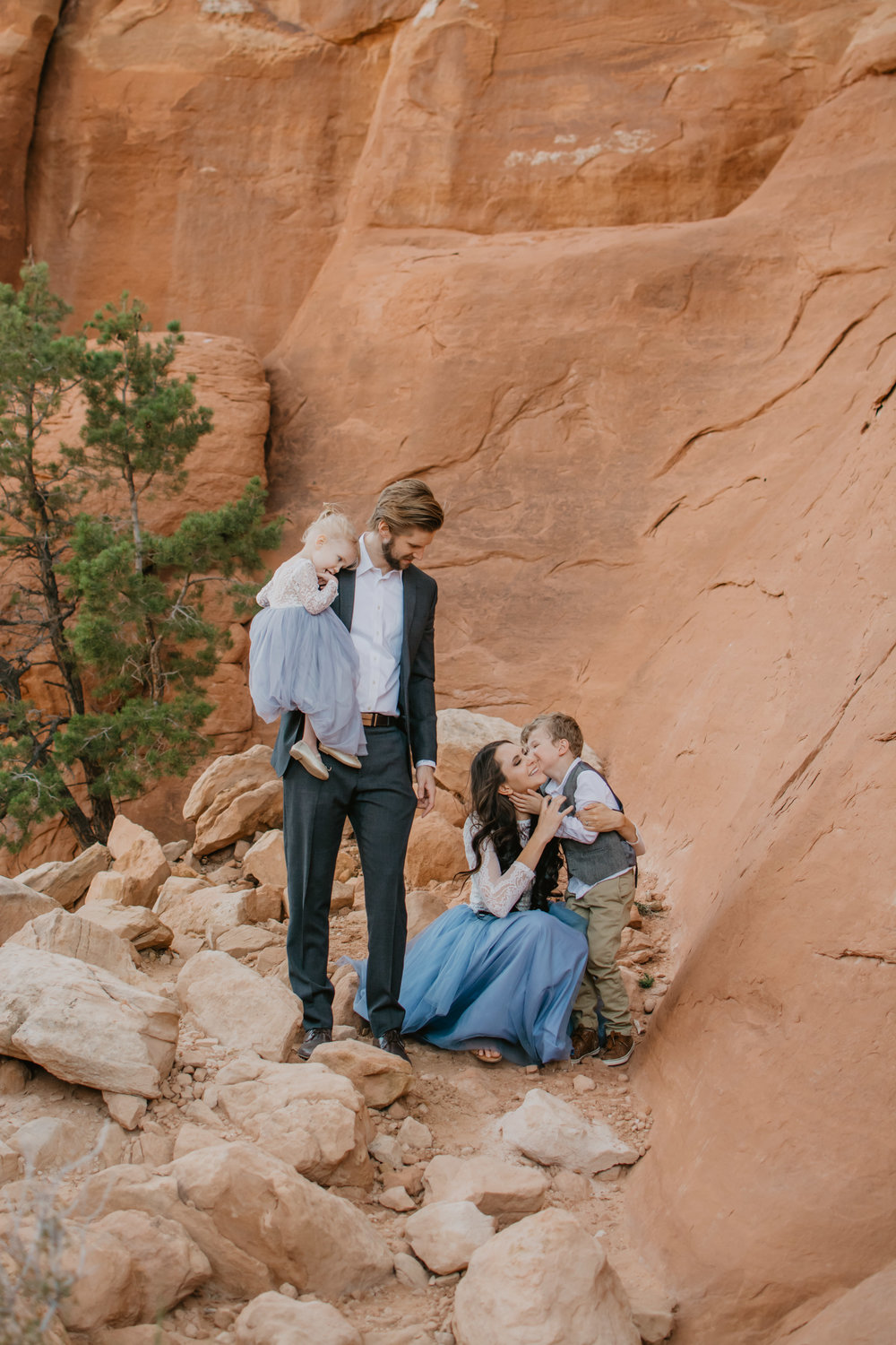 Jocilyn Bennett Photography | Family photo session | Family picture pose ideas | Family portraits | Portrait Photography | Capturing raw and genuine emotion | Utah Photographer | Idaho Photographer | Adventure Photographer | Candid Photography | Candid family poses | Family pictures outfit ideas | Color ideas for family photos | Arches National Park | Family pictures at Arches National Park |