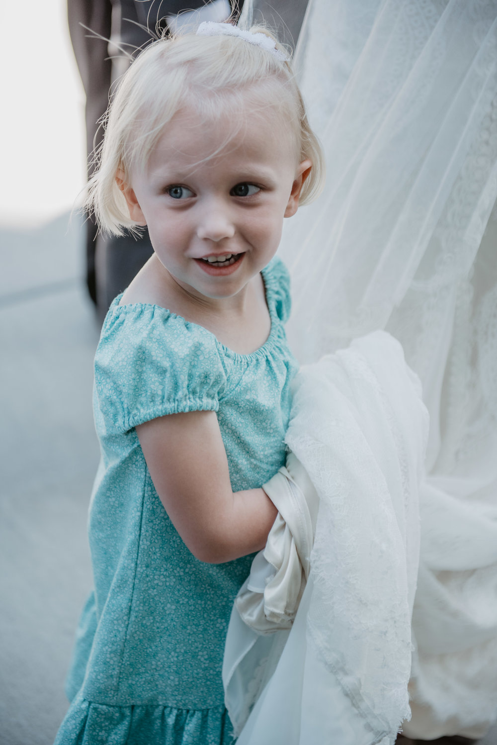 Jocilyn Bennett Photography | Utah Bride | LDS Bride | Utah Wedding Photography | When Two Become One | LDS civil wedding ceremony | Blending religions in families | Capturing Raw and Genuine Emotion | Combining Traditions | LDS Logan Temple | Temple Sealing | Little Girl Holding Bride’s Train |
