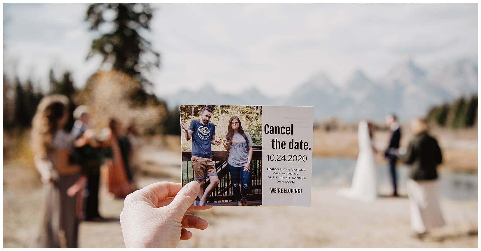 Covid pandemic elopement in the mountains announcement being held in front of the couple as they elope in the Tetons