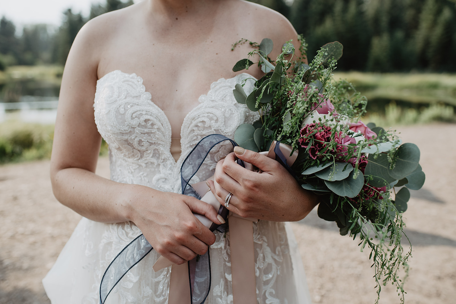 outdoor wedding floral bouquet with bride in a lace wedding dress at her Jackson Hole wedding 