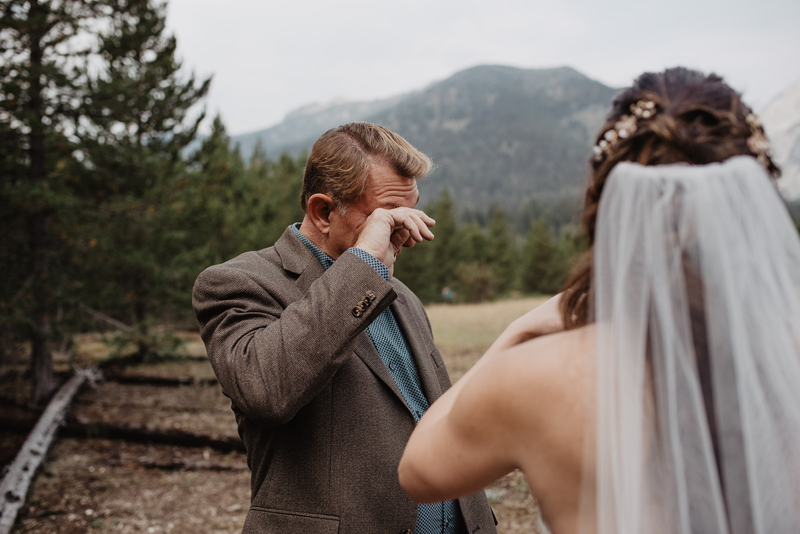 father daughter first look on Grand Tetons adventure wedding day with dad crying happy tears