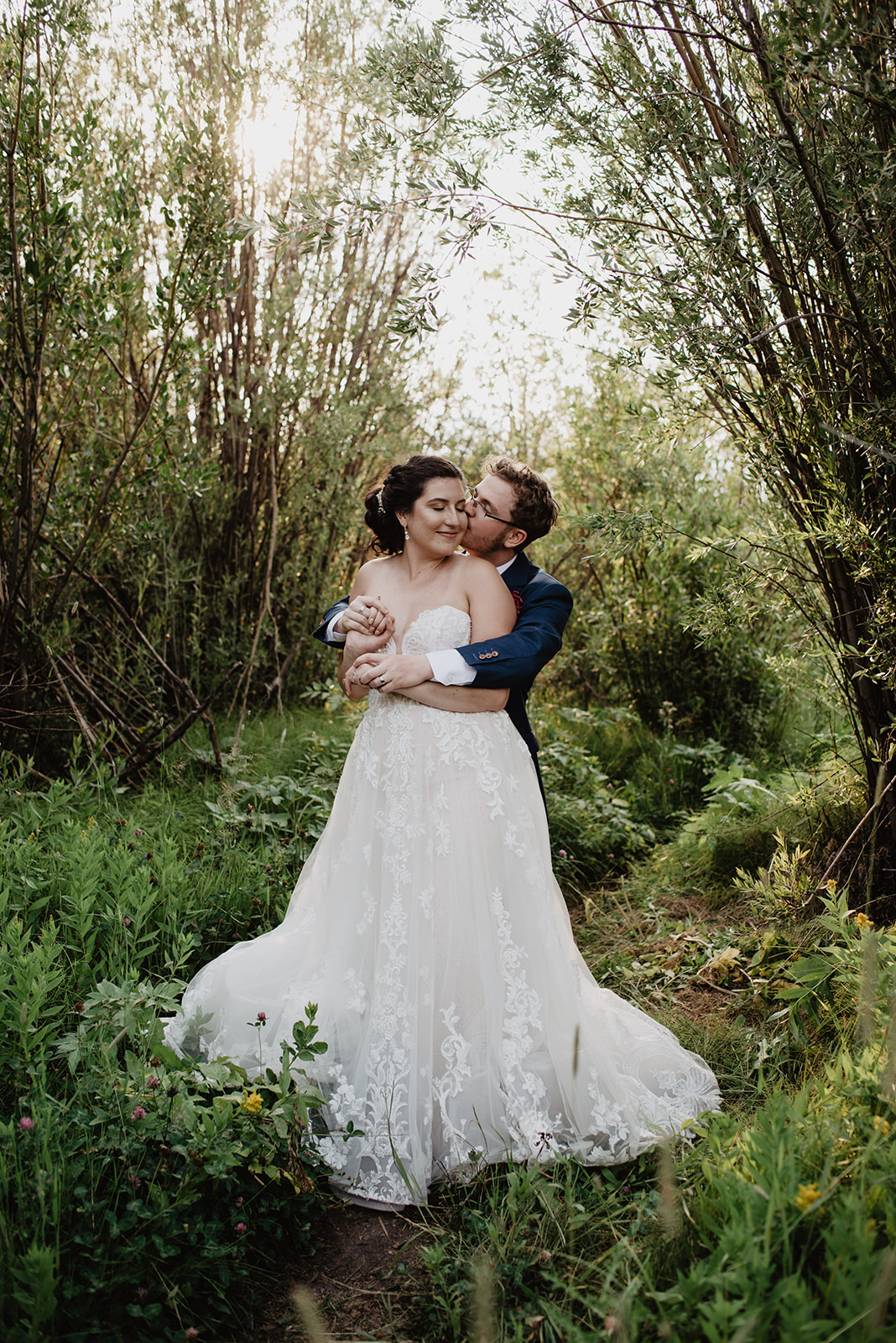 Jackson Hole photographers capture bride and groom in a secret garden at their elopement venue in Jackson Hole 