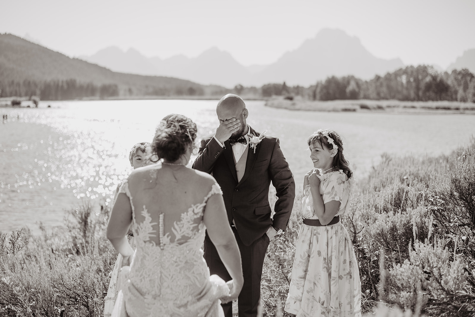 groom getting emotional at first look with his bride in Oxbow Bend Jackson Hole weddings 