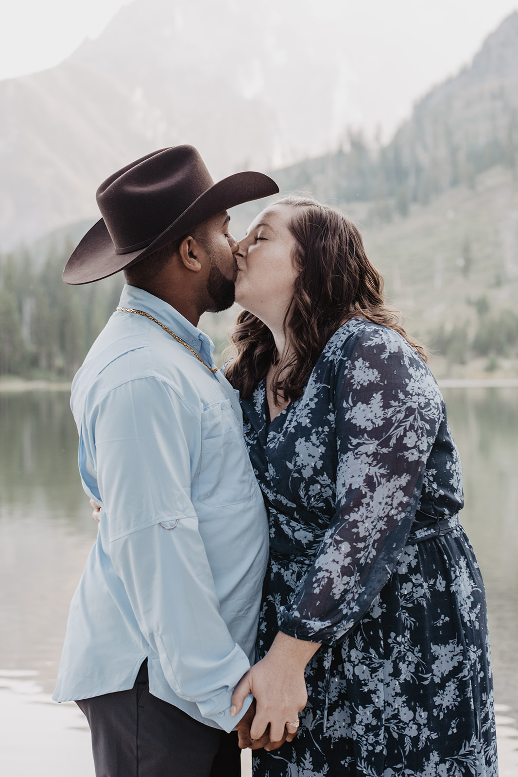 engagement photos at Jackson Hole with couple kissing at String Lake
