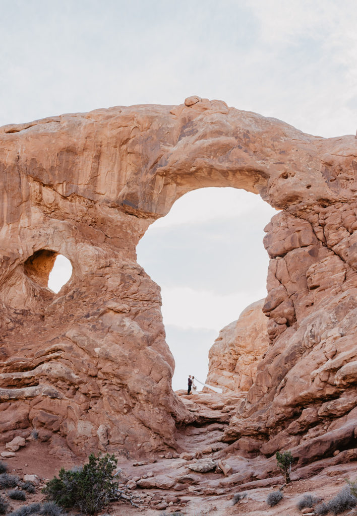 Arches elopement photographer captures couple eloping in Moab under the Arch