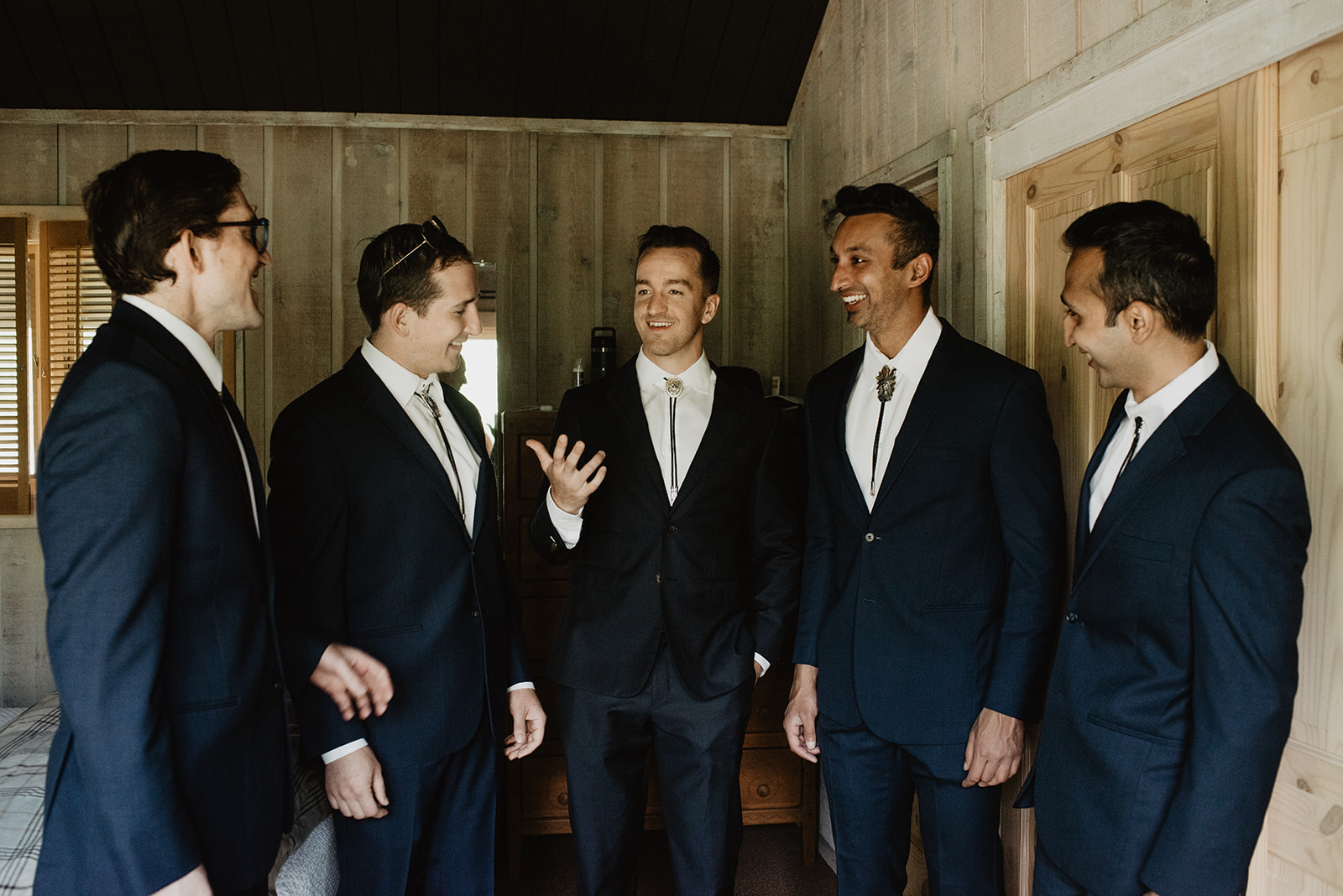 groom standing with his groomsmen before the ceremony