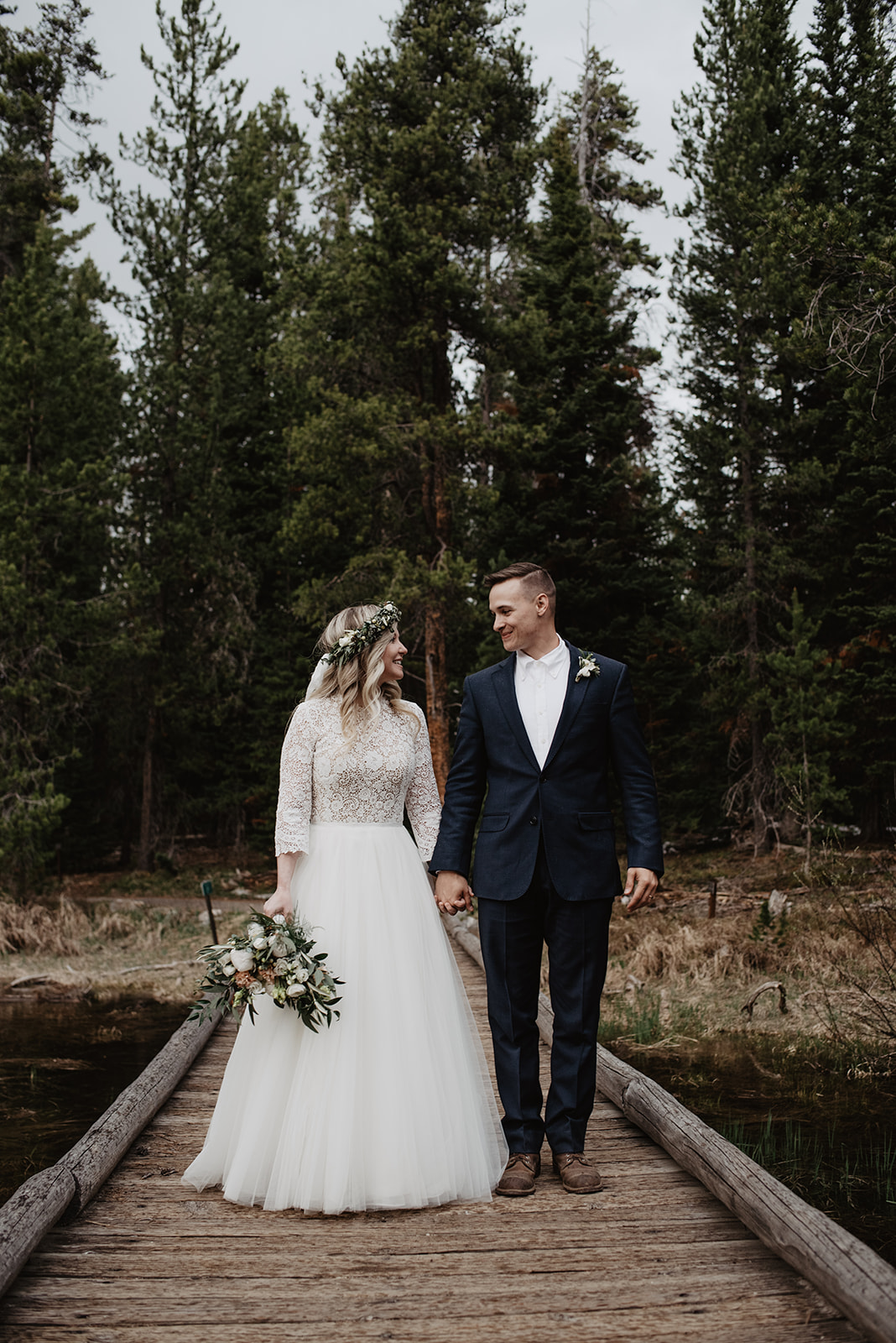 bride and groom holding hands at String LAke for their Spring Elopement in Grand Tetons