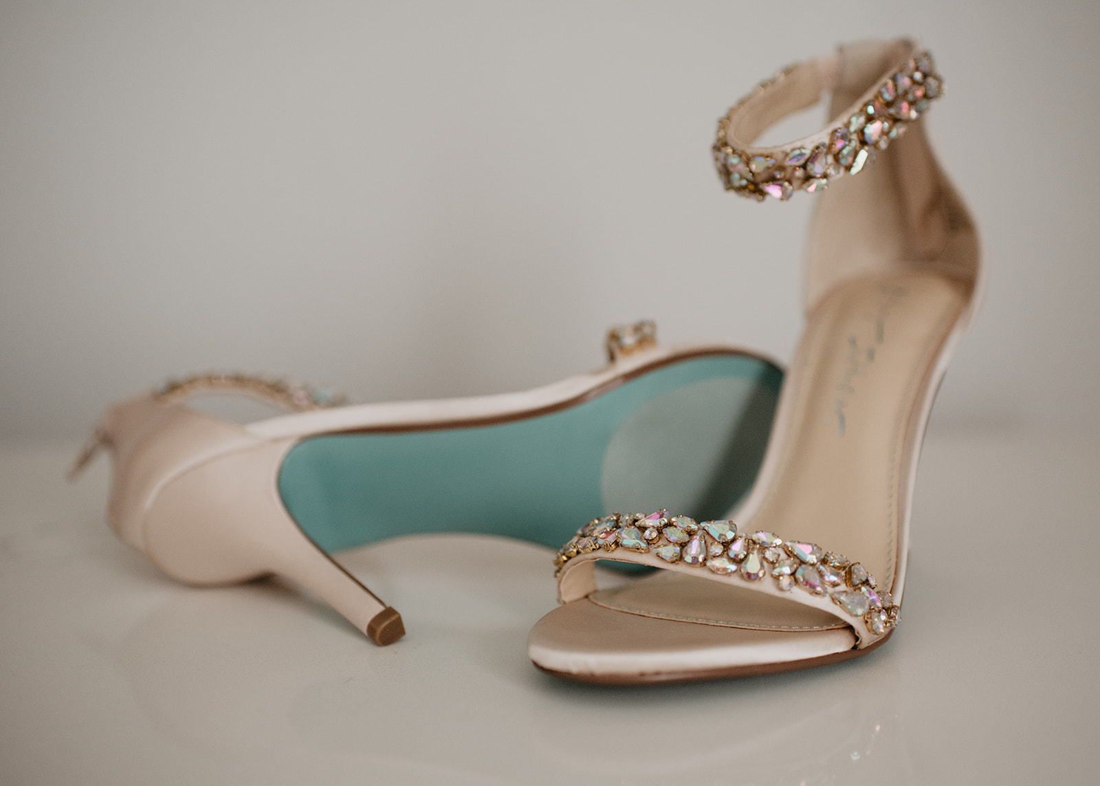 detail shot of bridal shoes on a white background and crystal details