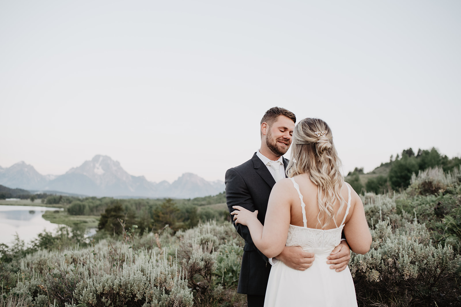 bride and grooms first look together at a sunrise session in Jackson Hole