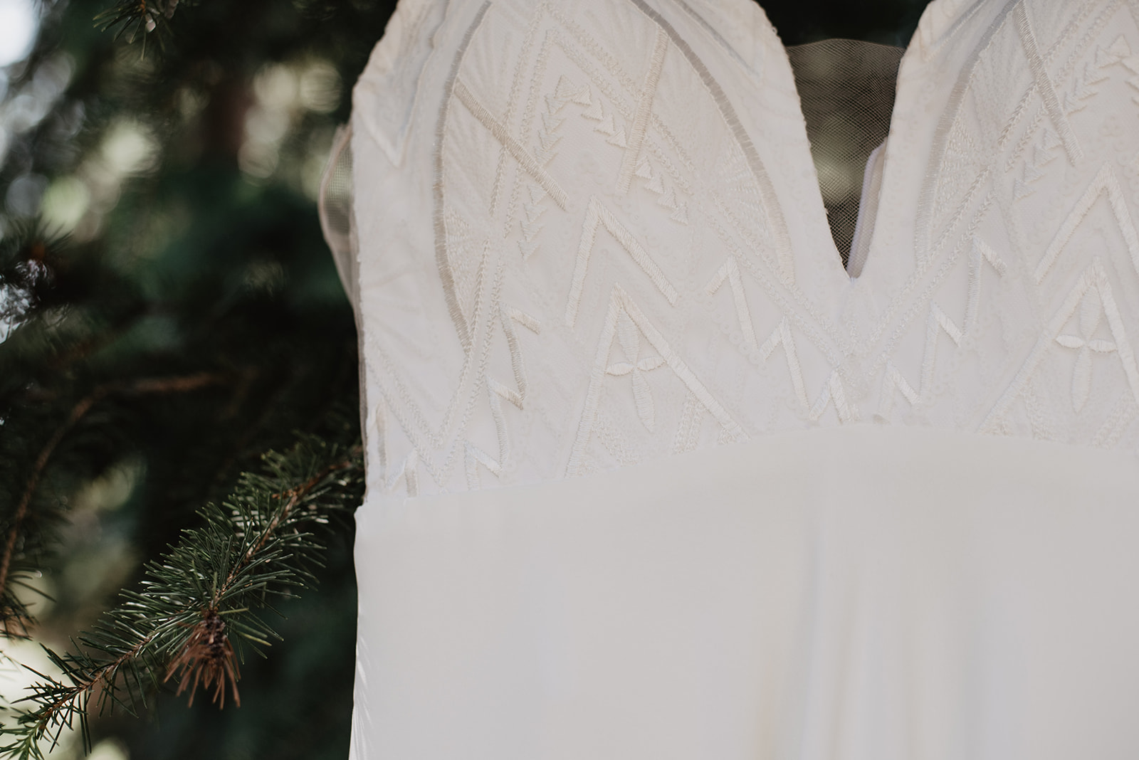 detail shot of brides wedding dress made custom to her for her Jackson Hole elopement
