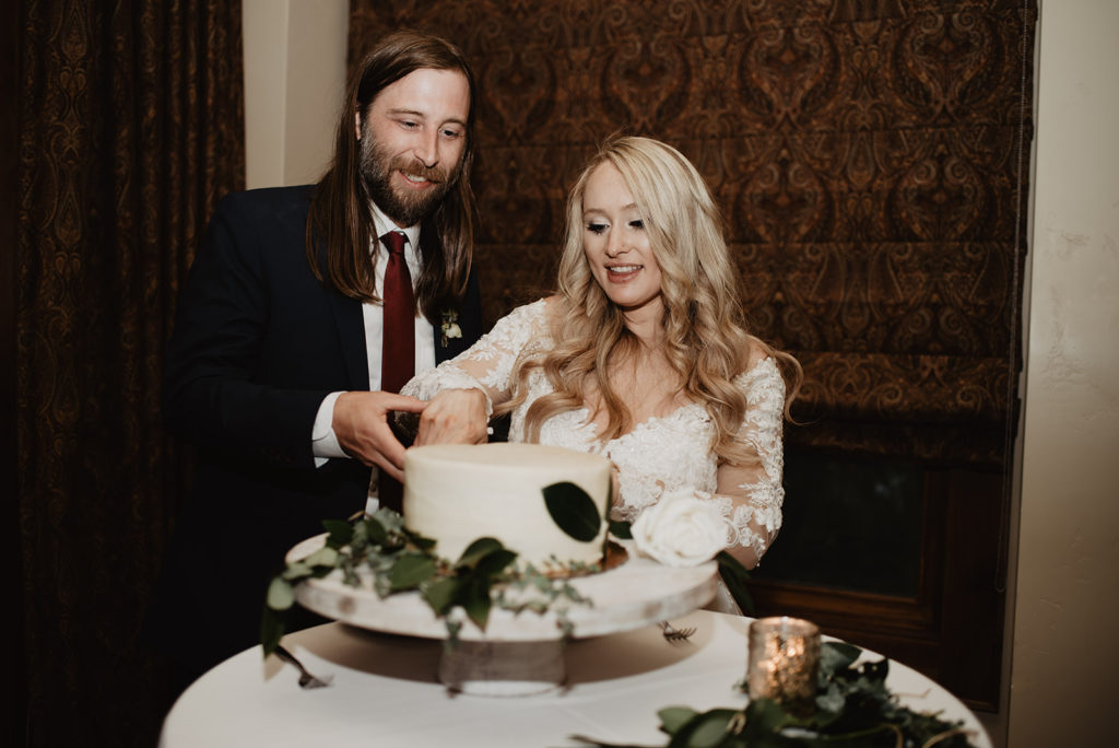 bride and groom cutting their wedding cake at their wedding reception in Jackson Hole 