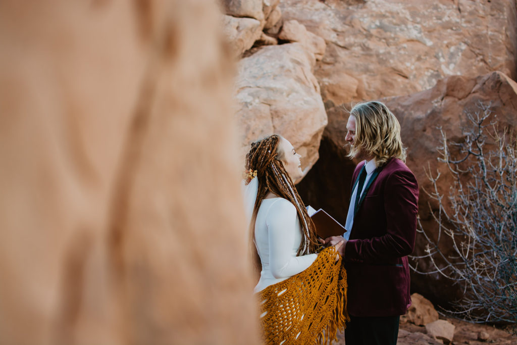 Utah elopement photographer captures first look between bride and groom for their destination elopement at Arches National Park wedding 