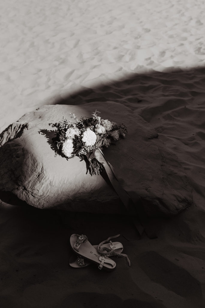 Utah elopement photographer captures bridal bouquet sitting on rock