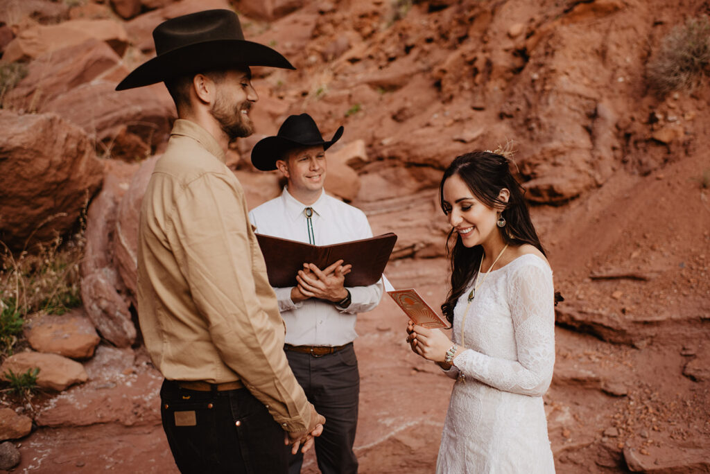 Utah Elopement Photographer captures bride and groom reading vows to one another