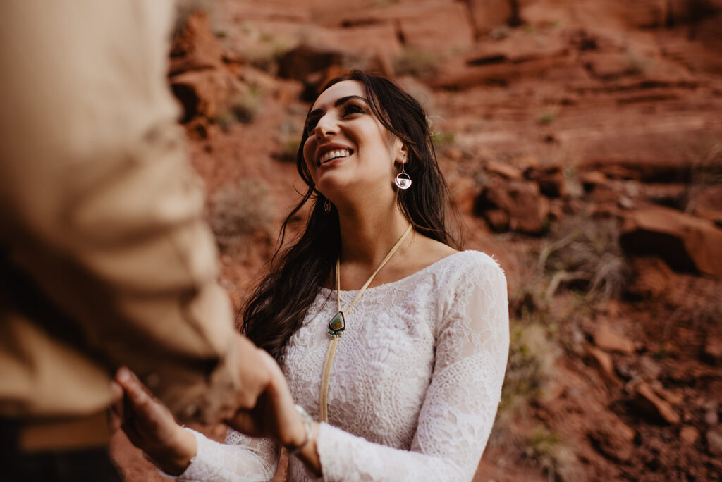 Moab elopement photographer captures bride smiling at groom