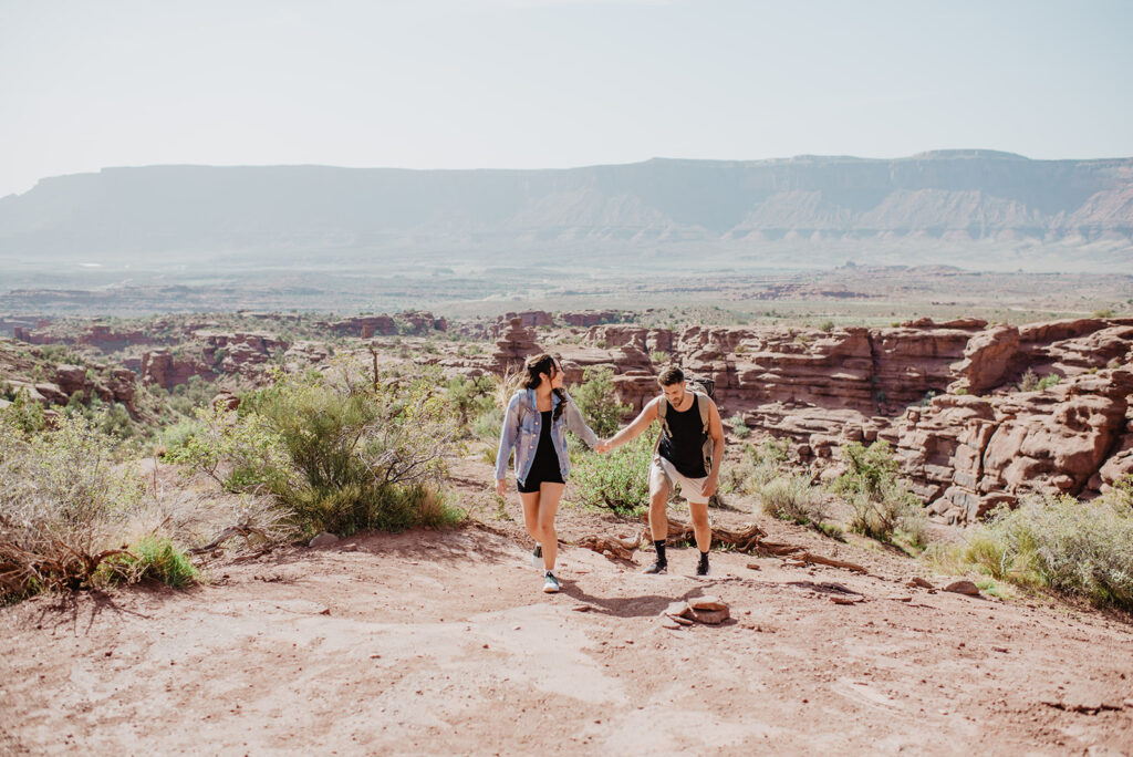 Utah elopement photographer captures couple hiking in Moab 