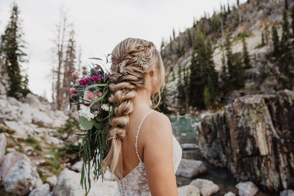 Jackson Hole photographer captures close up of bridal hairstyle of braid and flowers
