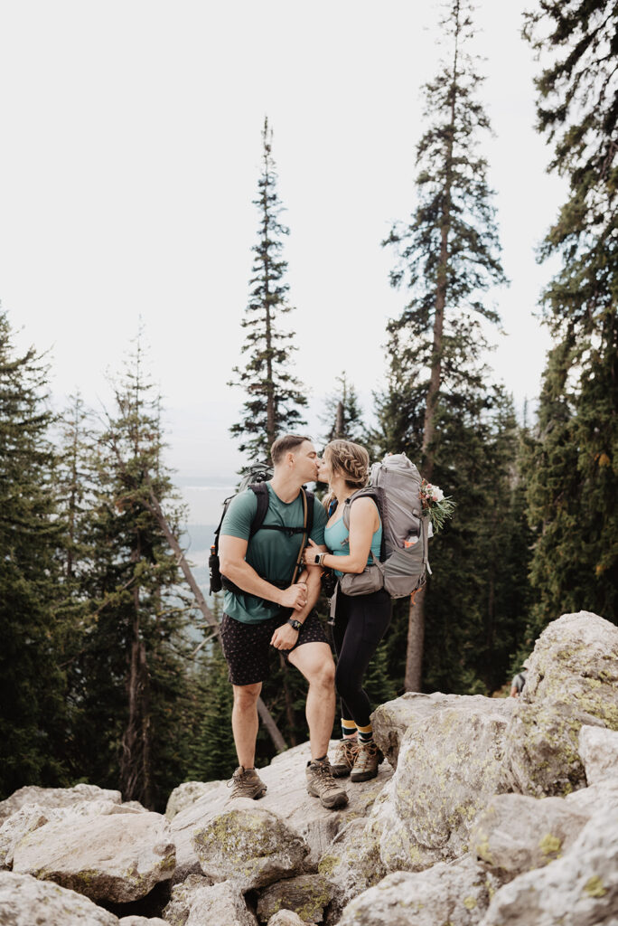 Jackson Hole photographer captures couple hiking in Jackson Hole kissing
