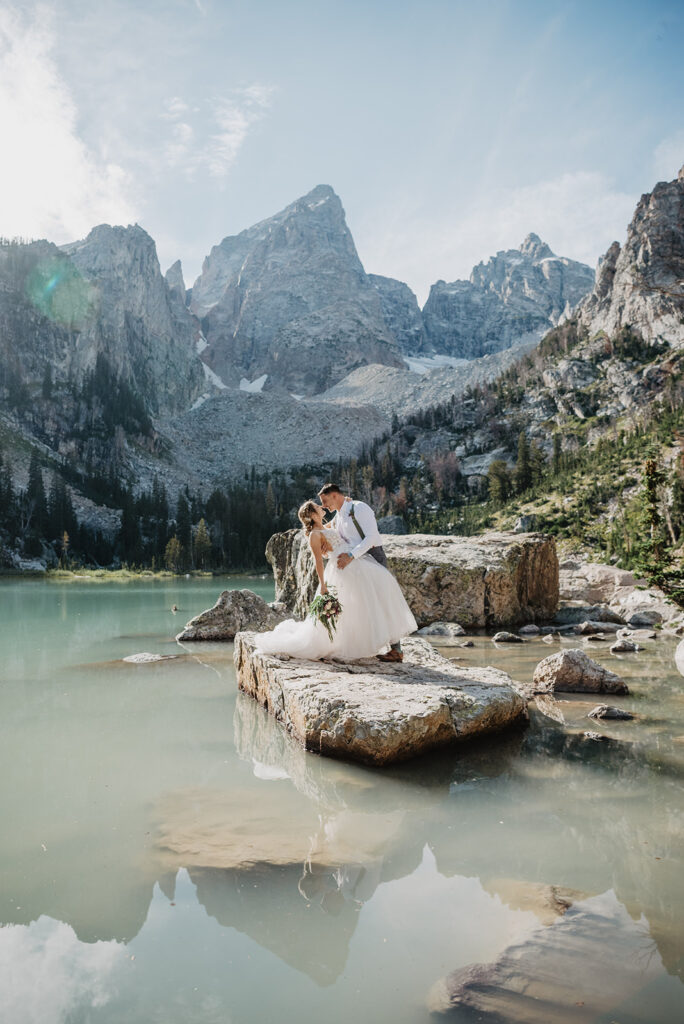 Jackson Hole photographer captures groom dip kissing bride in Grand Teton National Park