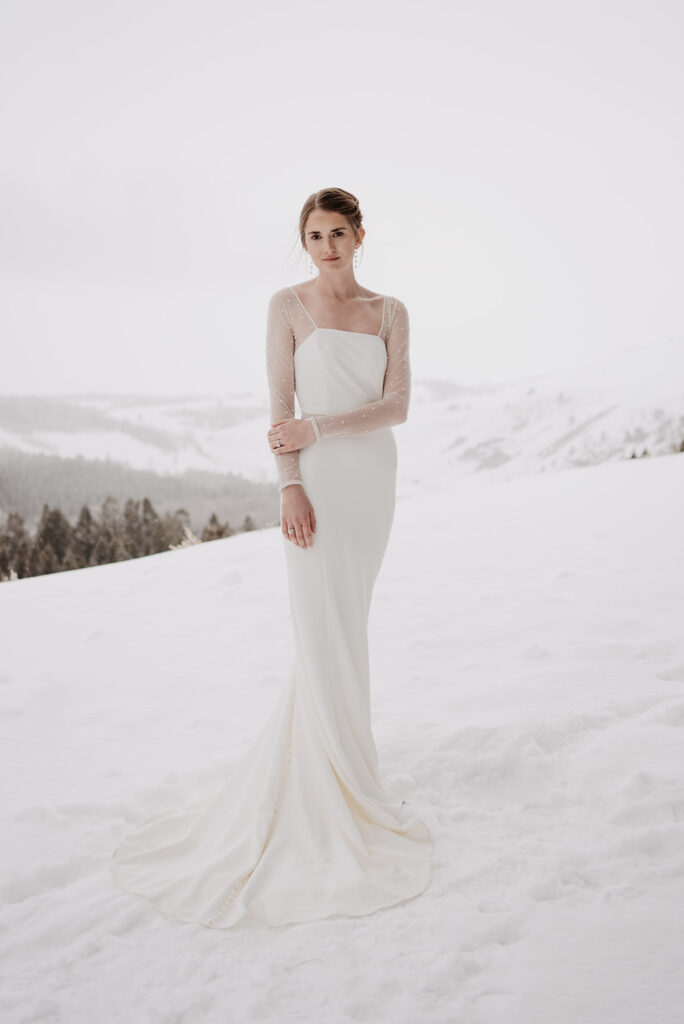 Grand Teton photographer captures bride wearing bridal gown in snowy winter wedding