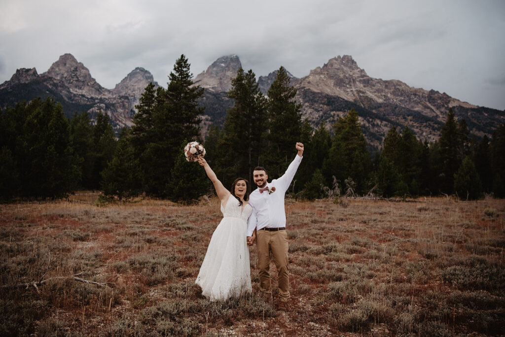 Photographers Jackson Hole capture bride and groom celebrating recent marriage