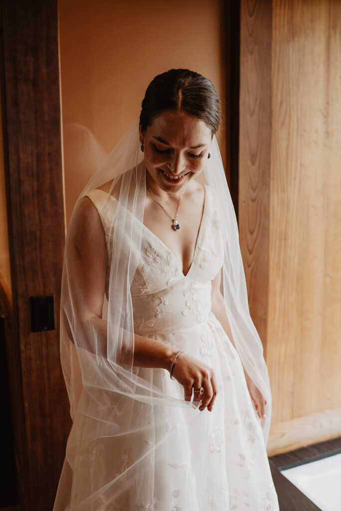 Jackson Hole wedding photographer captures bride wearing wedding dress and veil