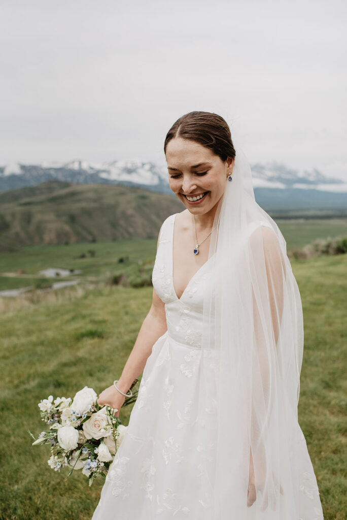 Jackson Hole wedding photographer captures bride walking in wedding gown after Amangani Wedding