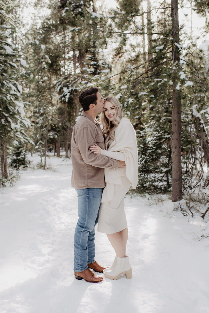 Jackson Hole wedding photographer captures couple embracing after surprise proposal