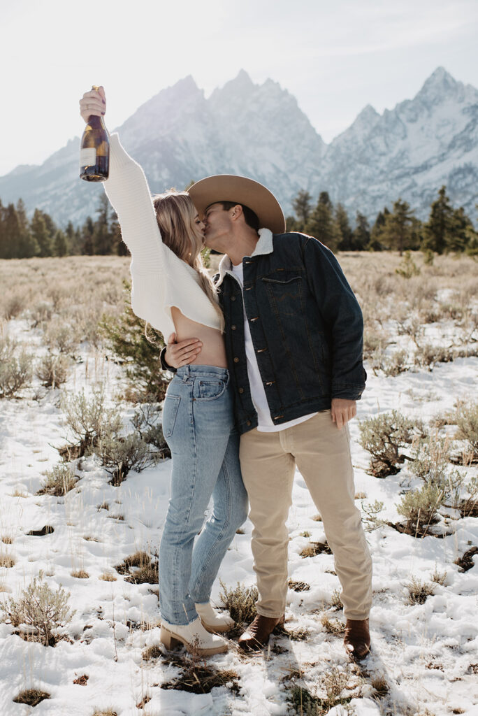 Jackson Hole wedding photographer captures couple celebrating and kissing