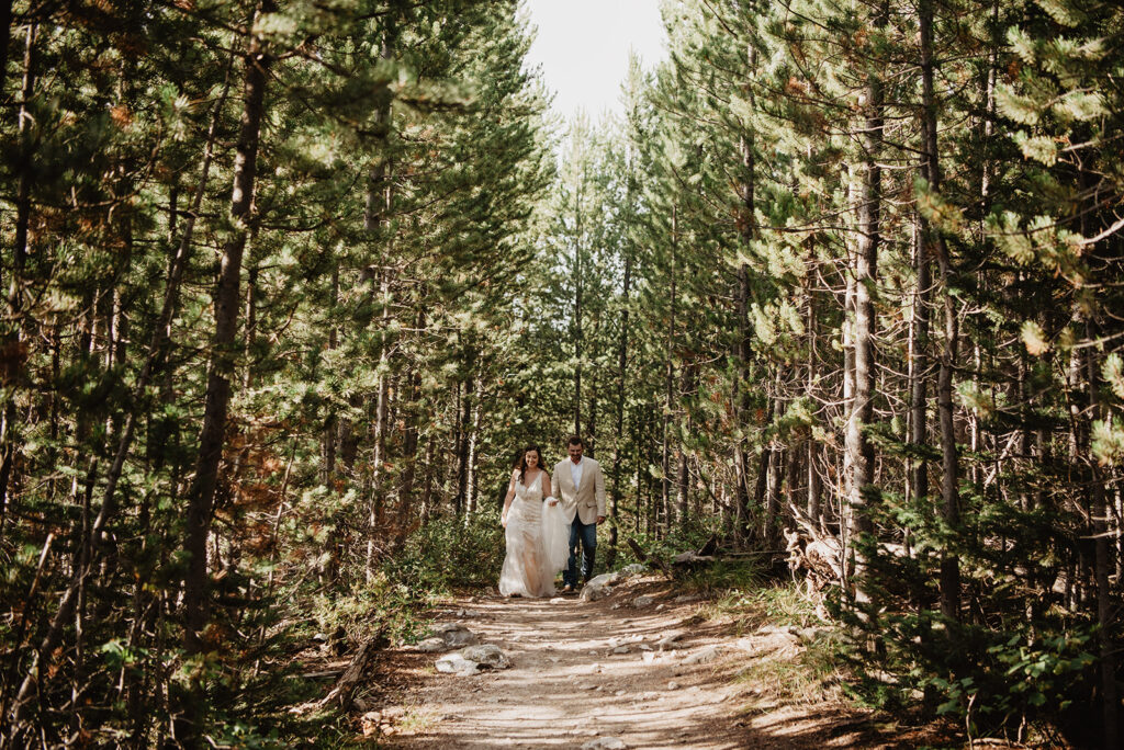 Jackson Hole elopement photographer captures bride and groom walking together 