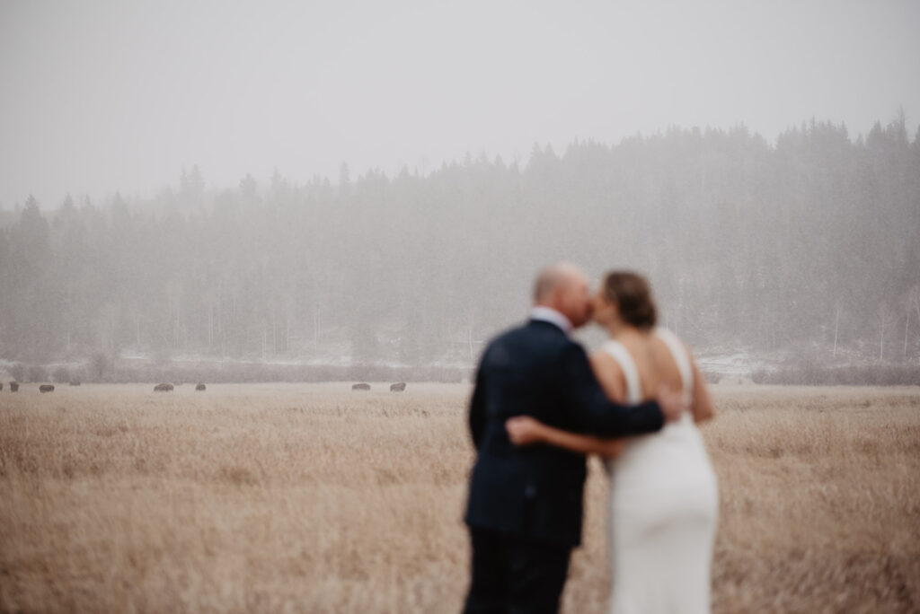 Jackson Hole elopement photographer captures bride and groom kissing 