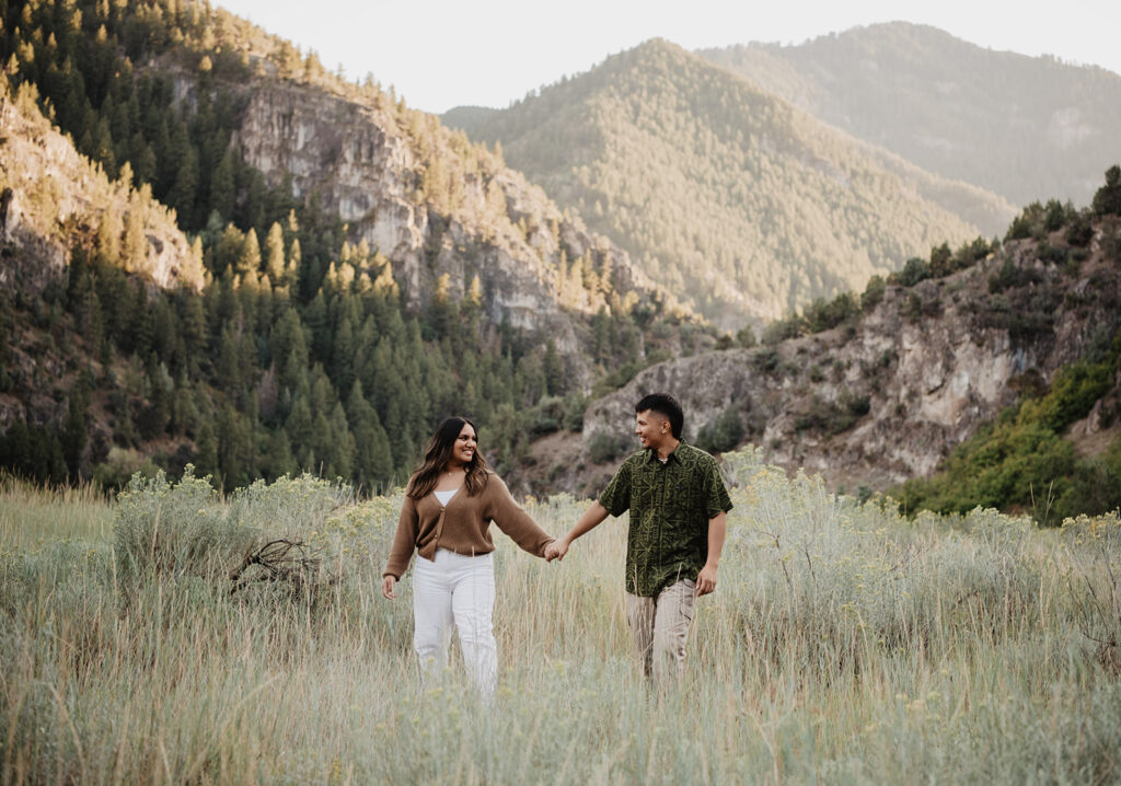 Utah elopement photographer captures man and woman holding hands during engagement photos