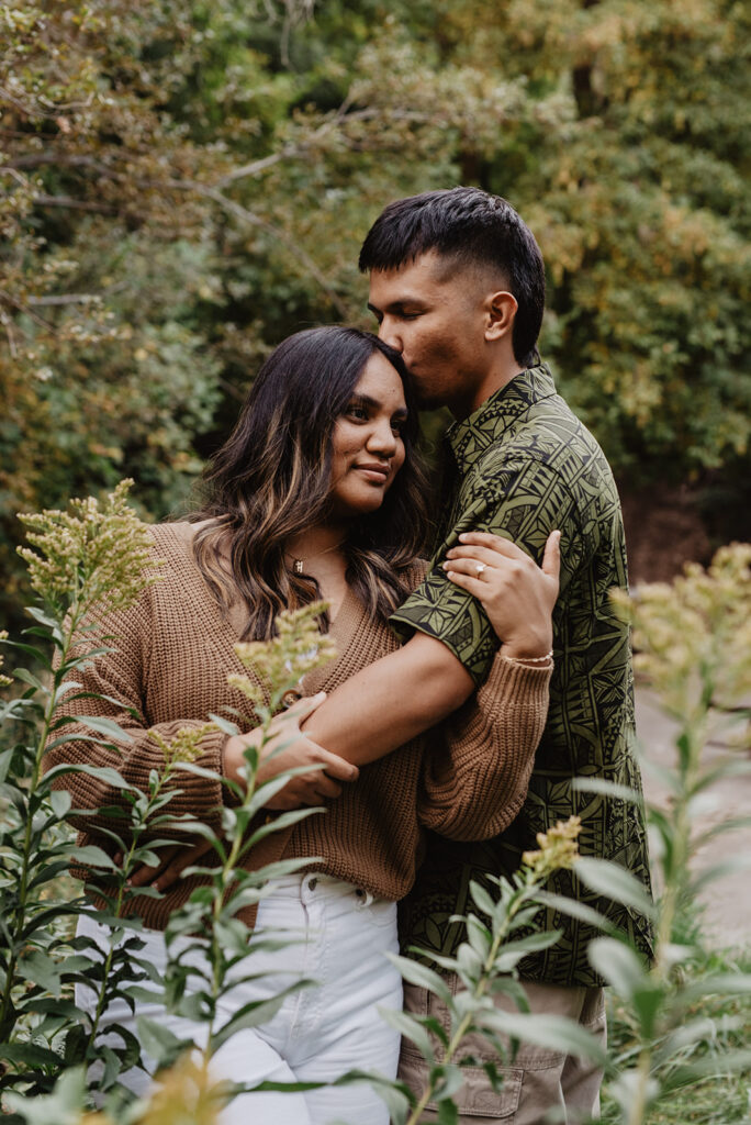 Utah elopement photographer captures man holding woman while kissing her hair