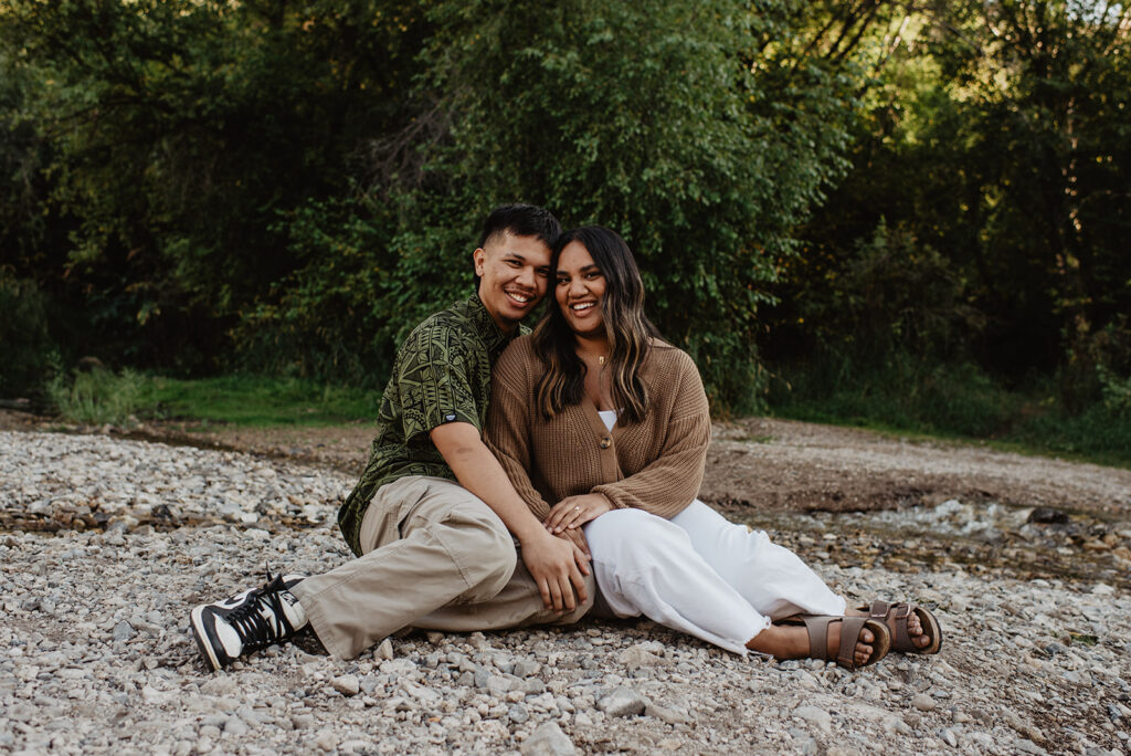 Utah elopement photographer captures couple sitting together during outdoor Utah engagement photos