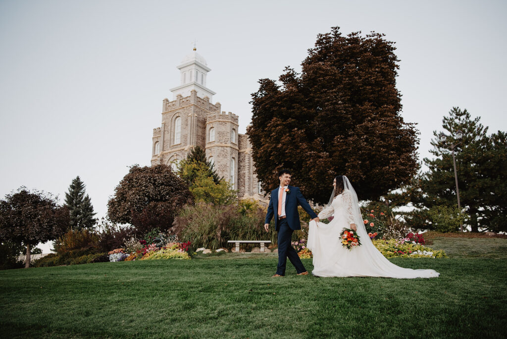 Utah elopement photographer captures bride and groom walking on grass