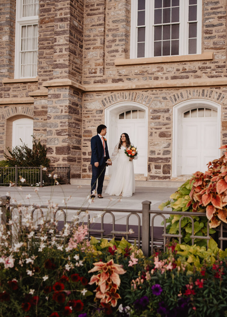 Utah elopement photographer captures bride and groom walking together at LDS Temple