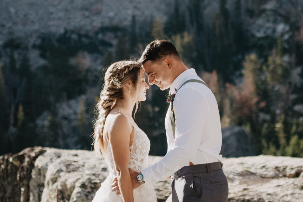 Jackson Wy photographer captures bride and groom touching foreheads after Grand Teton hike to their elopement