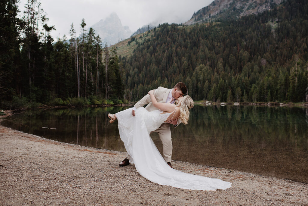 Jackson Hole Wedding Photographer captures groom dip kiss bride