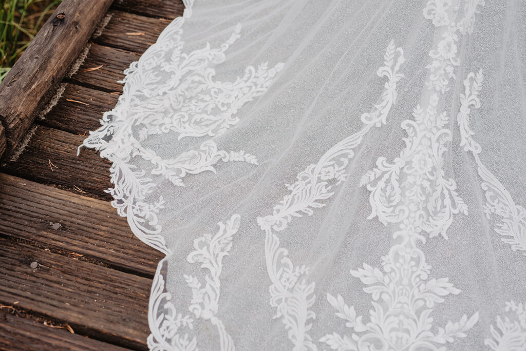 Jackson Hole Wedding Photographer captures close up of lace on wedding dress