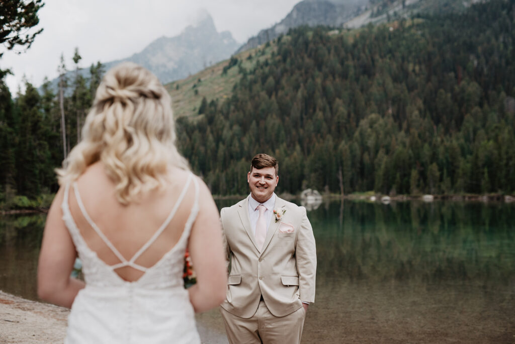 Jackson Hole Wedding Photographer captures groom seeing bride for first time on wedding day