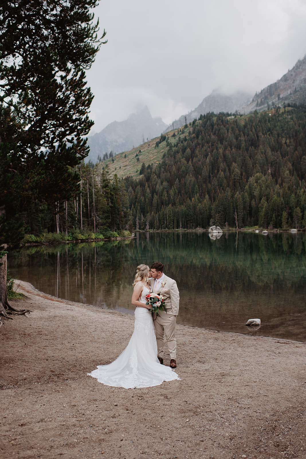Jackson Hole Wedding Photographer captures couple kissing after first look