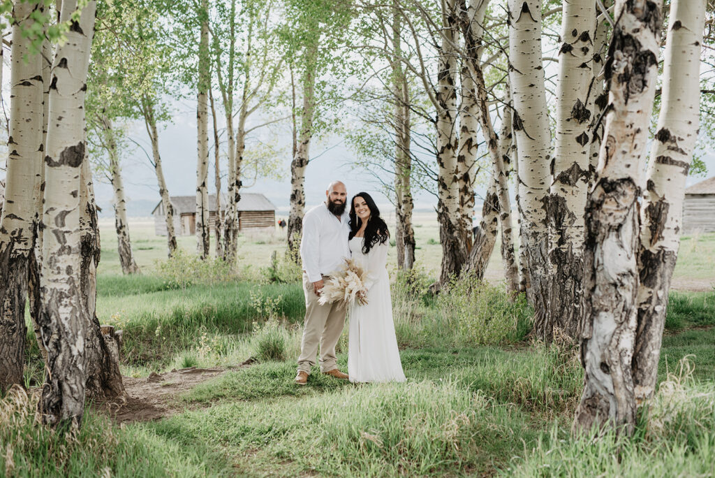 Wyoming Elopement Photographer captures bride and groom in forest 