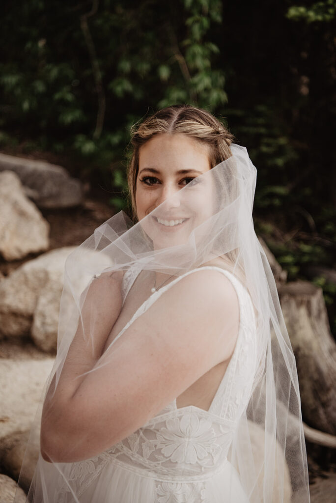 Grand Teton Wedding Photographer captures bride looking through veil 