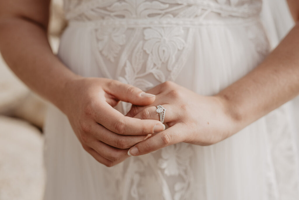 Grand Teton Wedding Photographer captures bride holding wedding rings